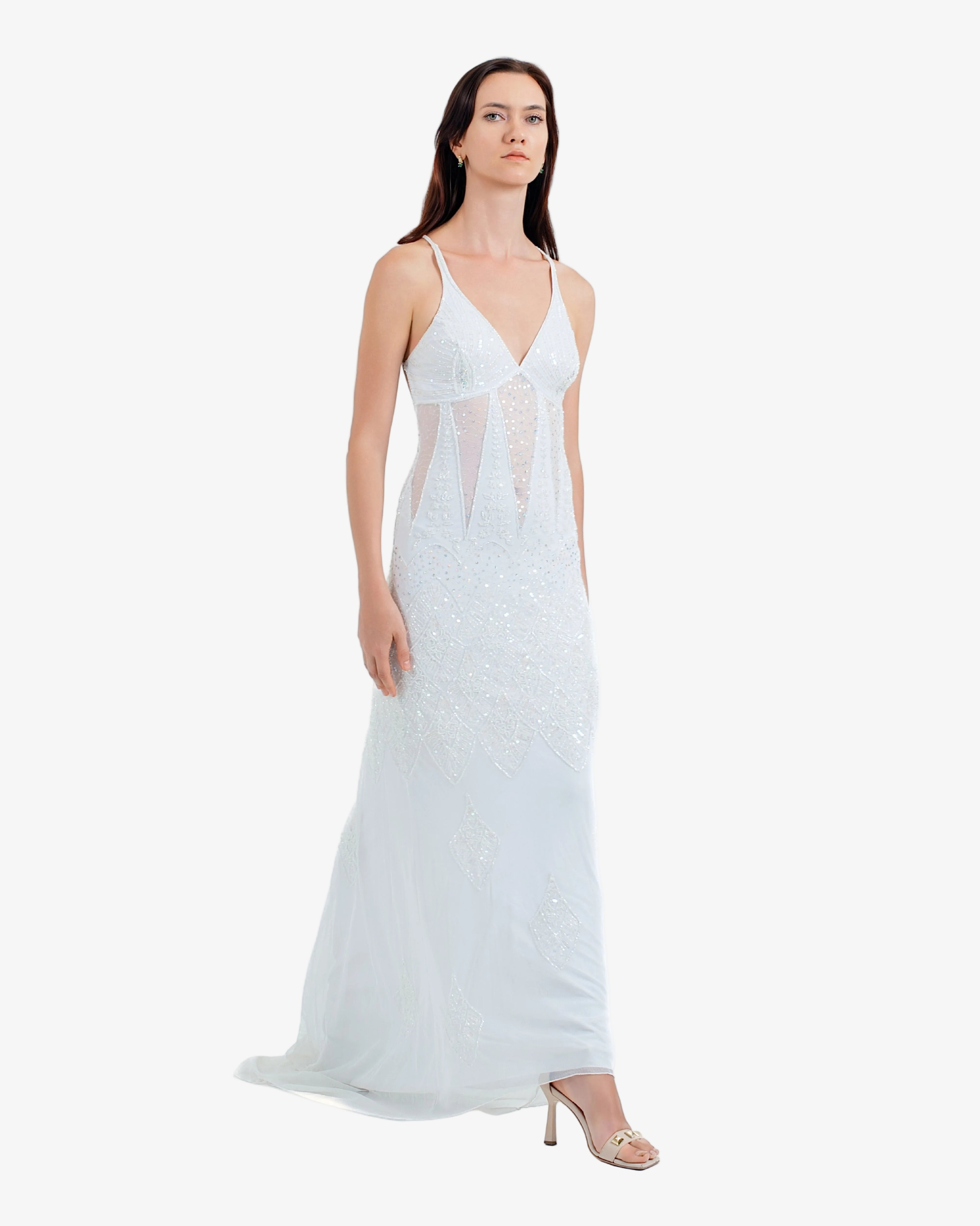Woman wearing a white lace dress on a white background