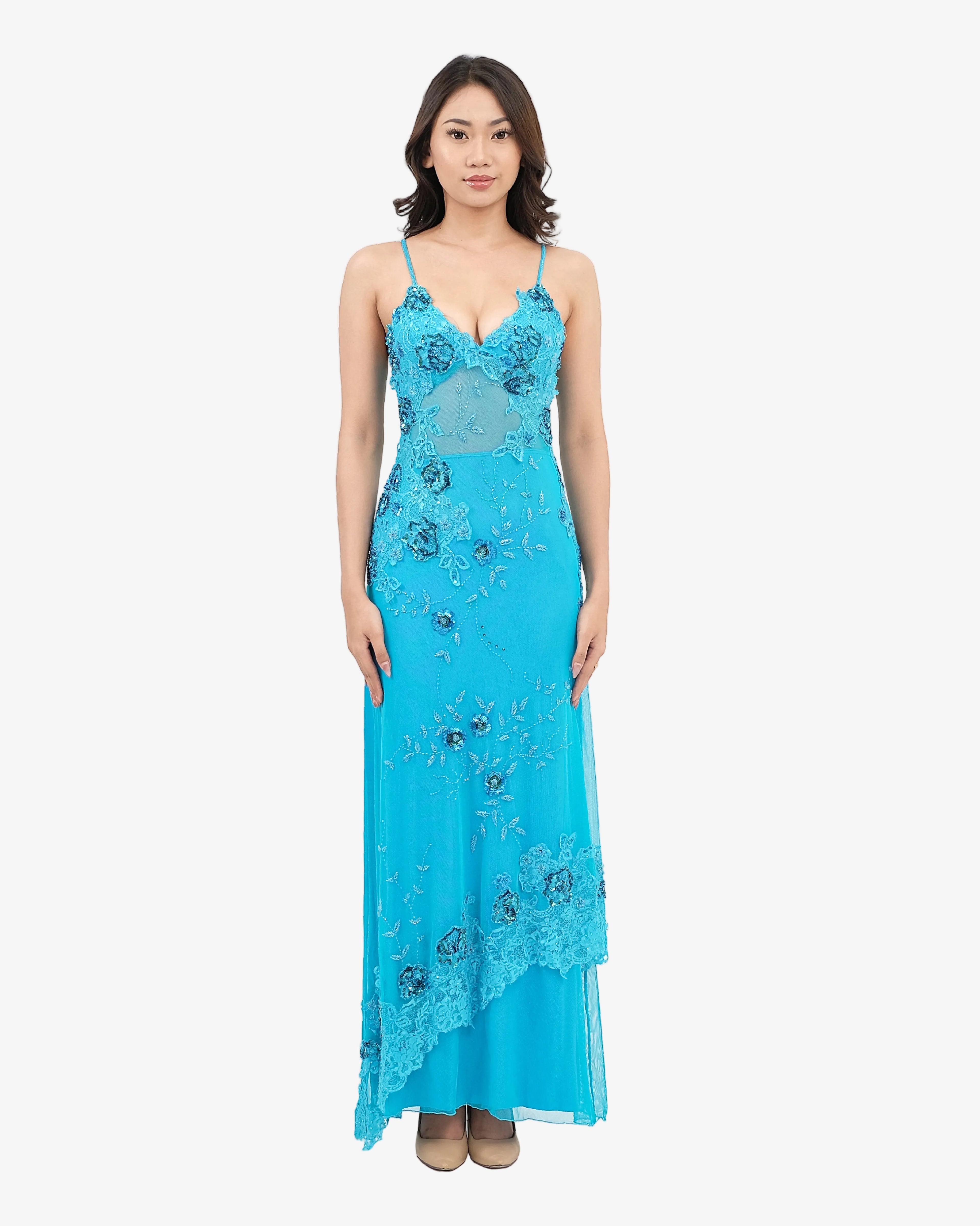 Woman wearing a Turquoise lace dress on a white background